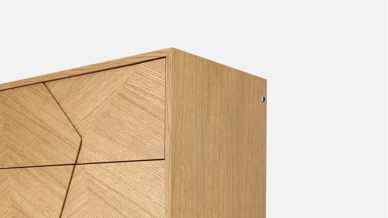 Chiffonnier ECLIPSE façades sculptées et piètement métal